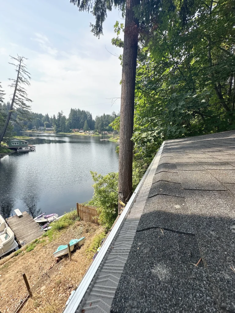 Lake House With New Gutter Filters and Roof Cleaning Service Outside of Portland, OR