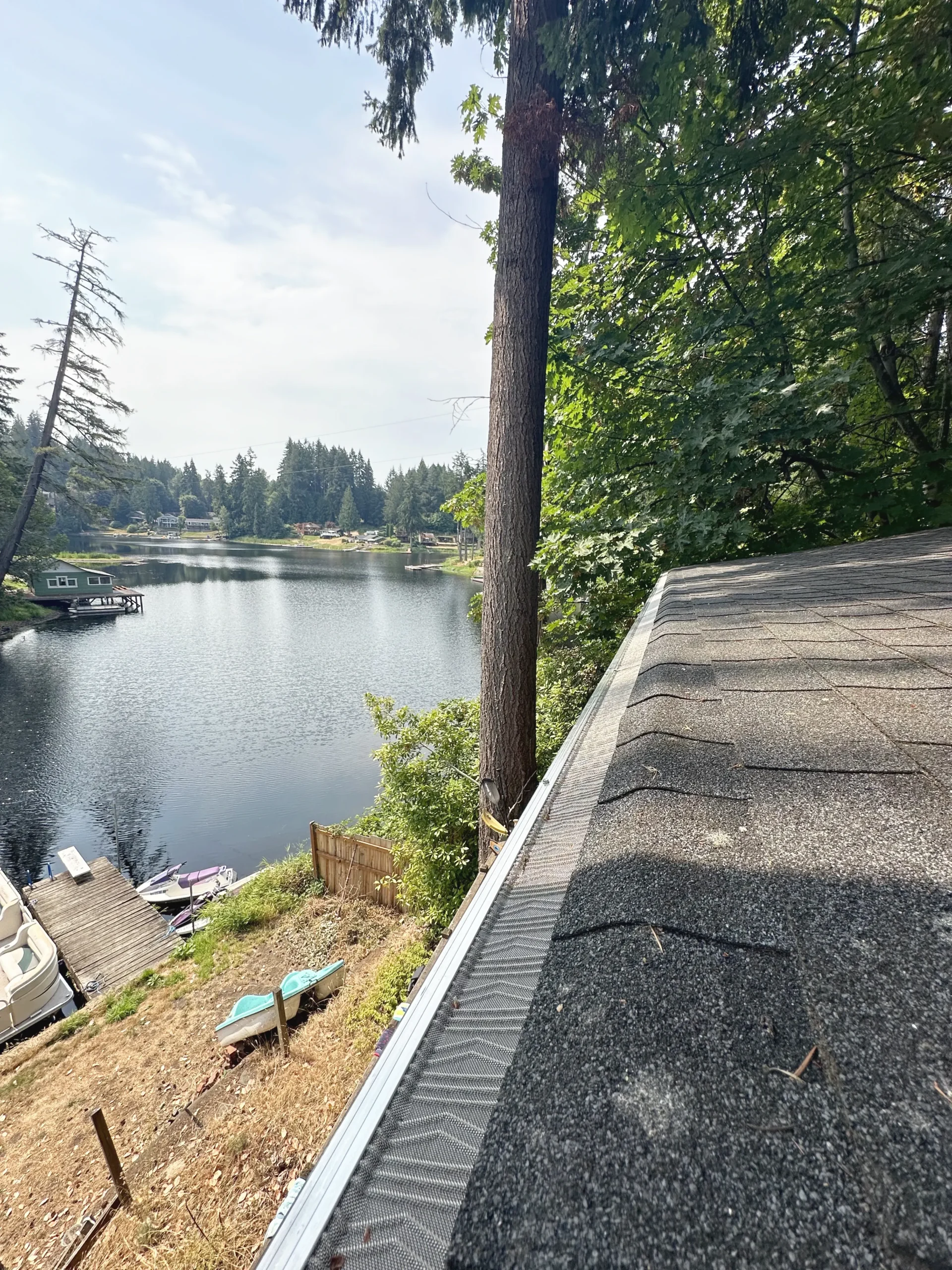 Lake House With New Gutter Filters and Roof Cleaning Service Outside of Portland, OR